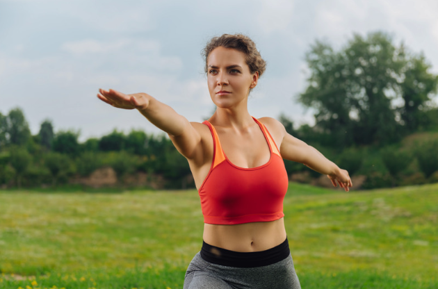 a heathy woman exercising balance outdoors representing metabolic balance
