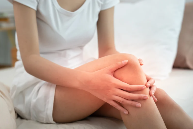 woman having knee injury due to ligament inflammation, knee pain