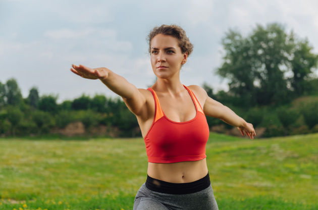 a heathy woman exercising balance outdoors representing metabolic balance 